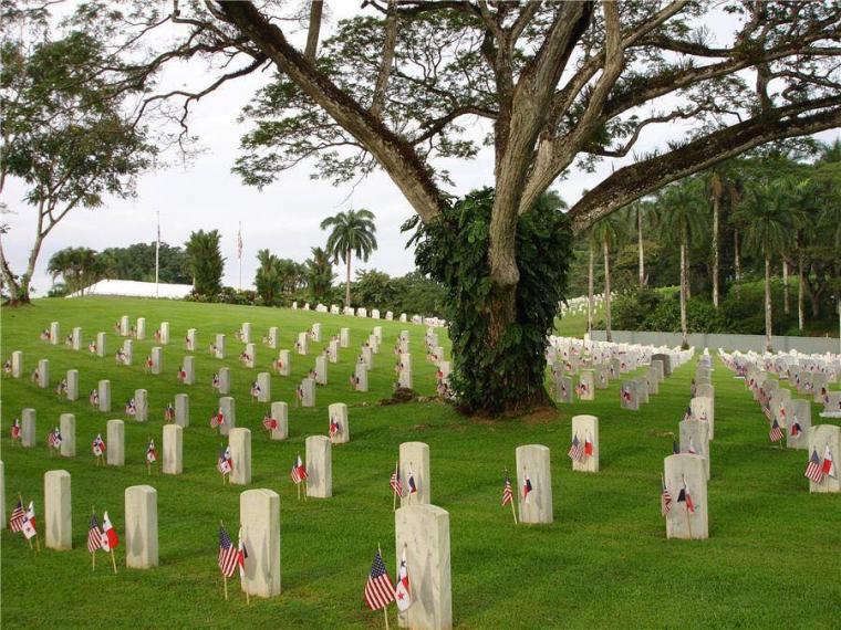Two flags are in front of every headstone. 