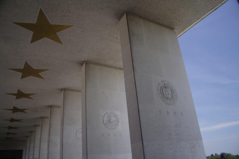 Columns and inlaid stars outside the memorial building at Henri-Chapelle American Cemetery.