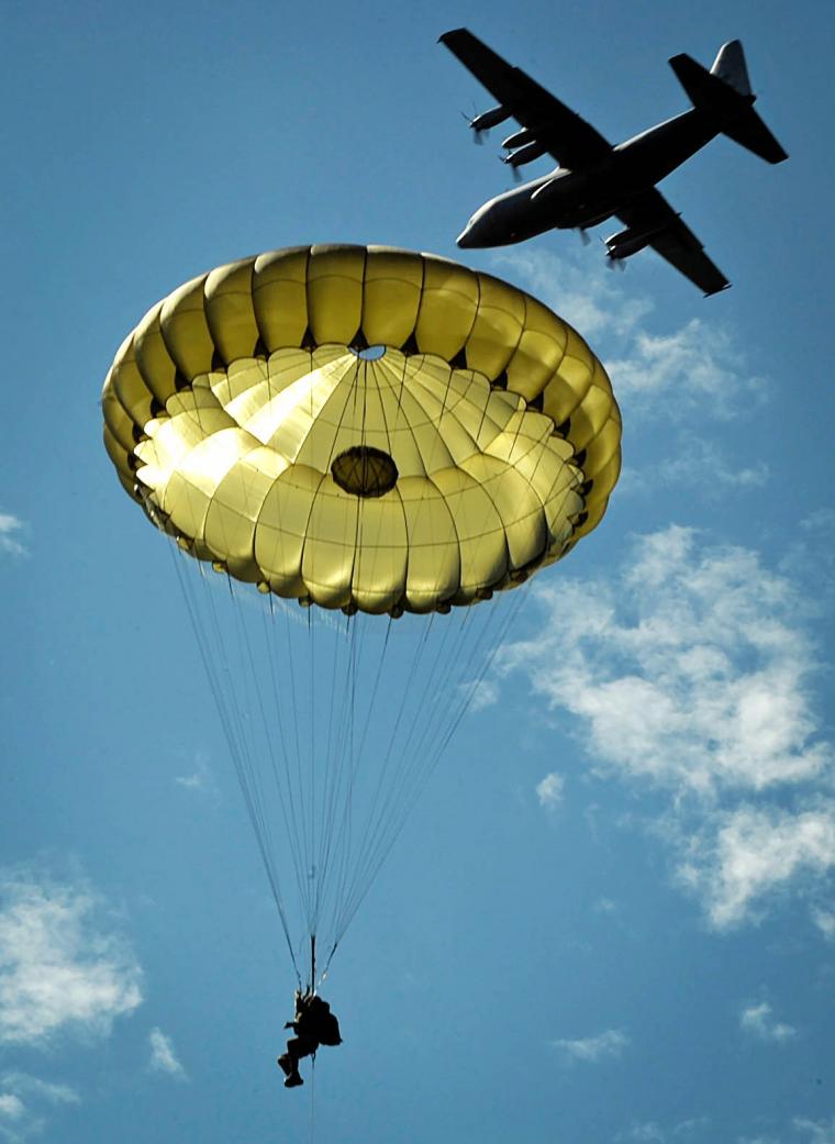 A paratrooper jumps onto the Iron Mike drop zone. 