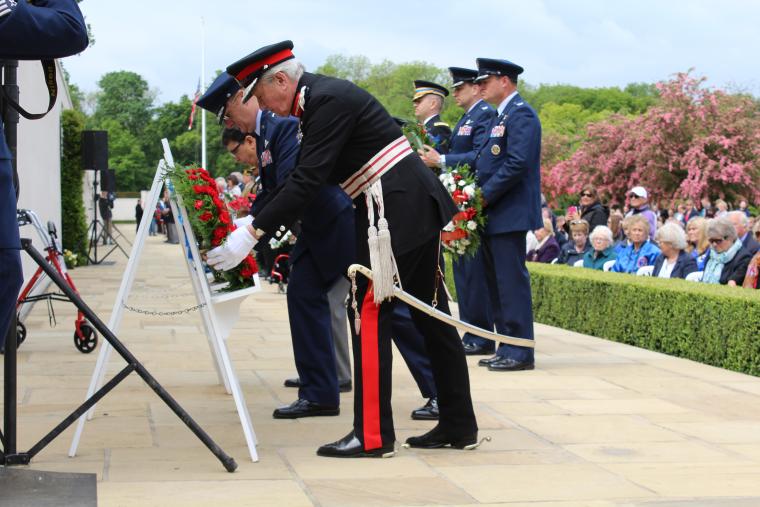 Members of the official party lay a wreath during the ceremony.