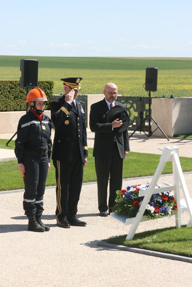 Members of the official party reflect after laying a wreath. 
