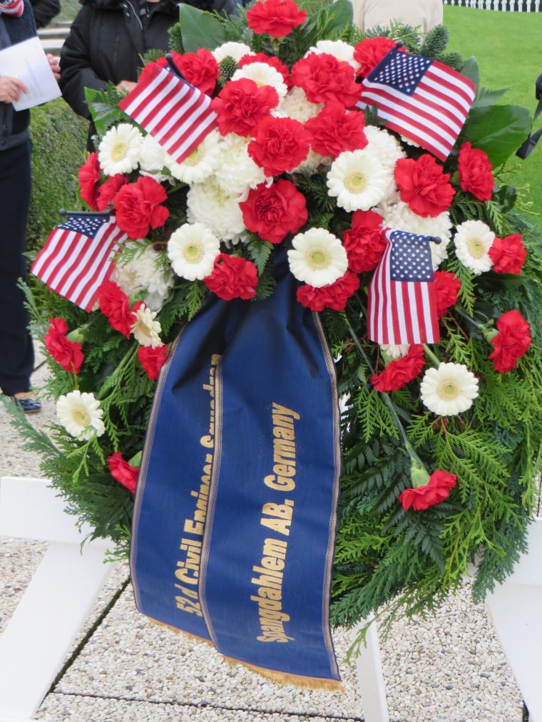 A floral wreath from Spangdahlem Air Base was laid during the ceremony. 
