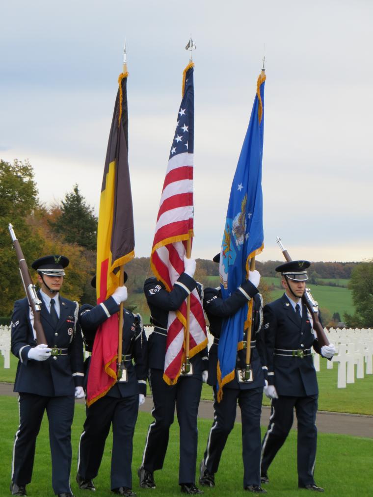 An honor guard marches during the ceremony. 