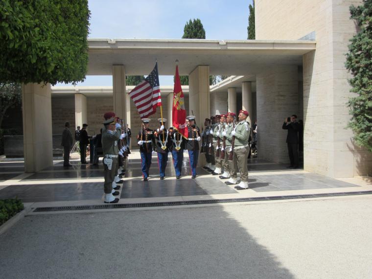American and Tunisian military march in during the ceremony. 