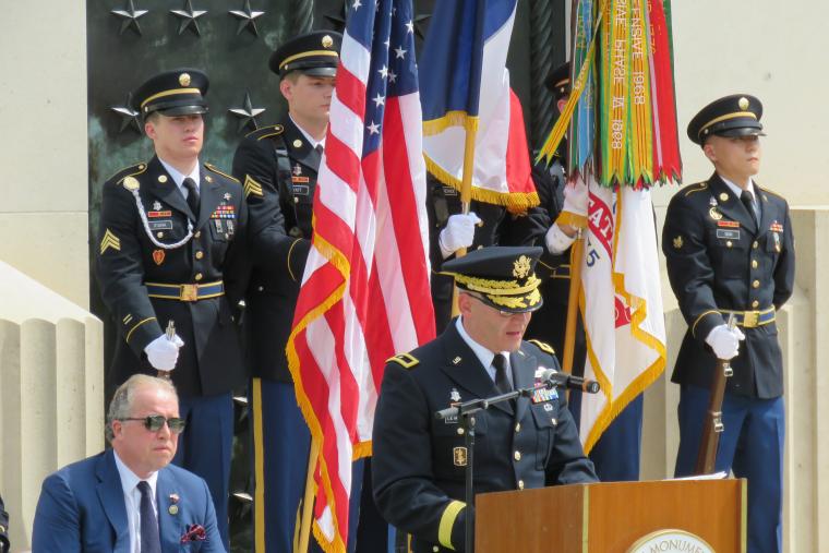 An Army officer delivers remarks from the podium. 