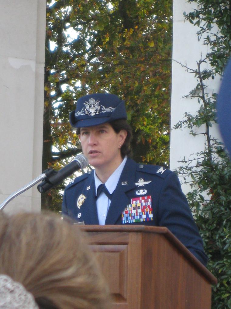 Col. Angela M. Cadwell delivers remarks form the podium. 