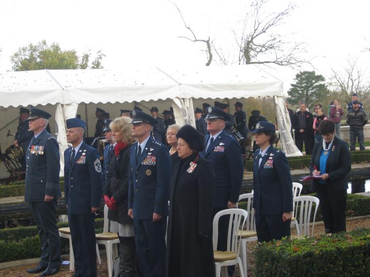 The official party stands during part of the ceremony.