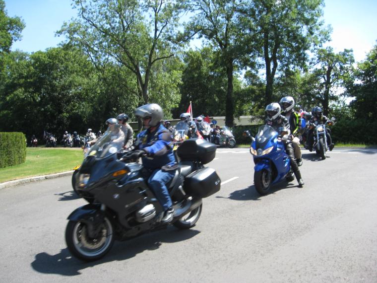 Bikers arrive at the cemetery for the ceremony. 