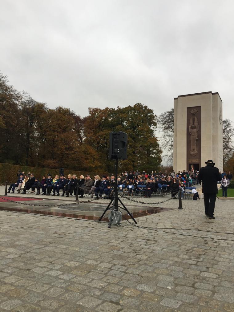 Attendees sit in front of the chapel during the ceremony. 