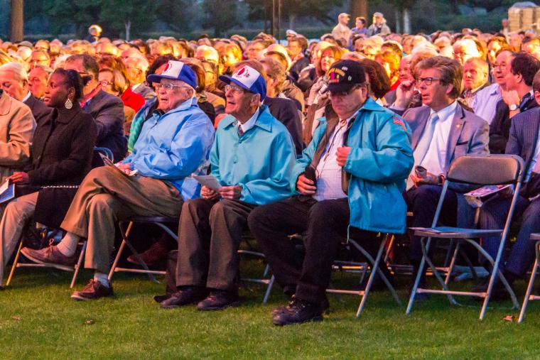 WWII veterans sit in the front row during the concert. 