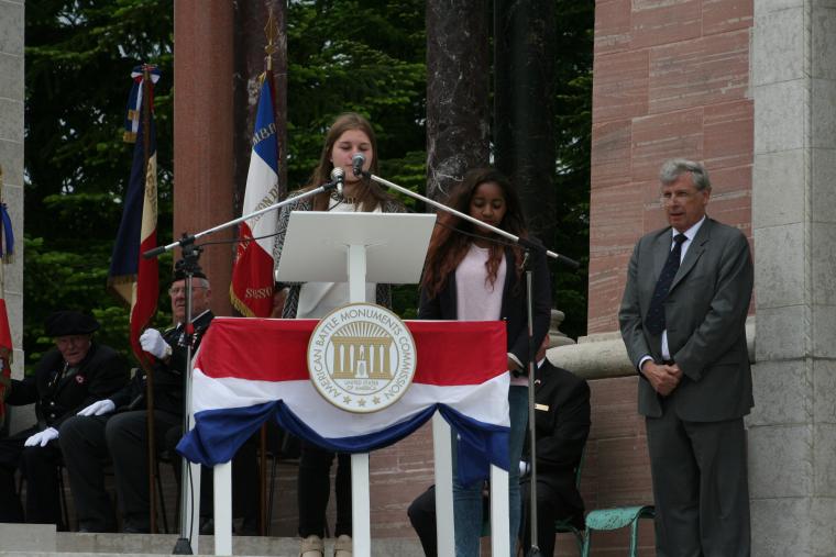 A student reads her poem during the ceremony. 