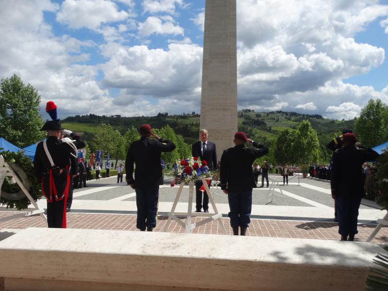 Members of the military salute after the ambassador laid his wreath.
