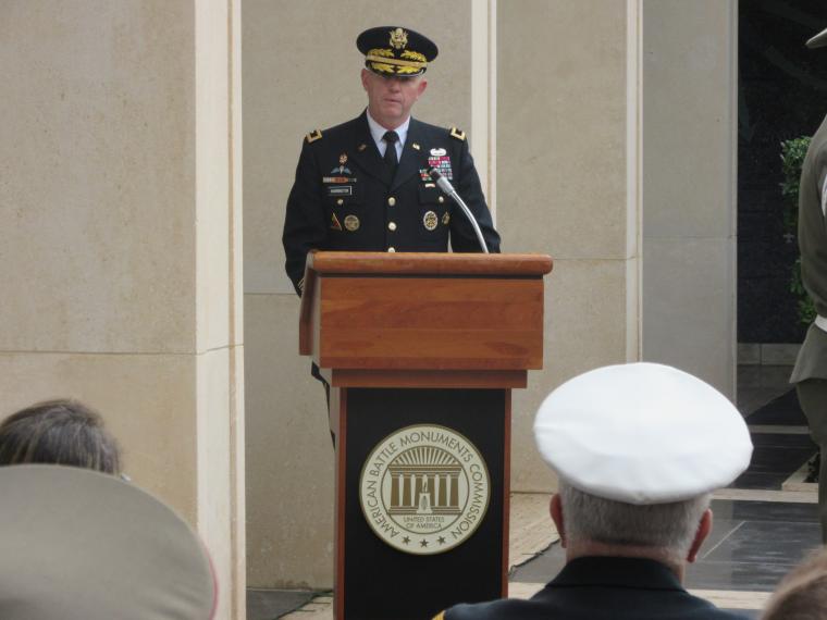 Maj. Gen. Harrington delivers remarks from a podium.