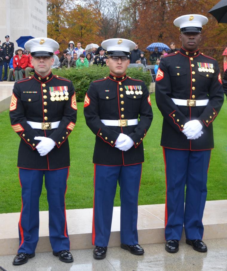 Three members of the Marine Detachment stand together during the ceremony.