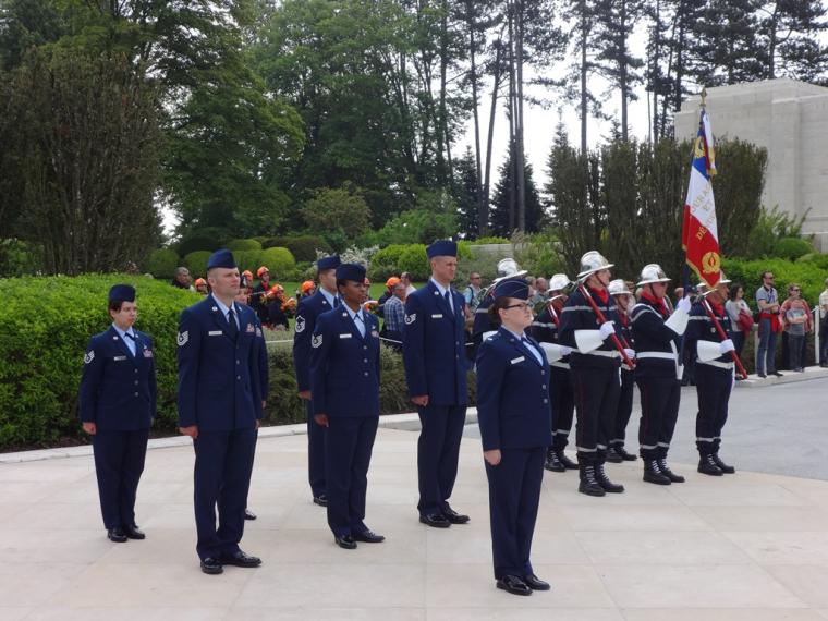 American military and French fireman participate in the ceremony.