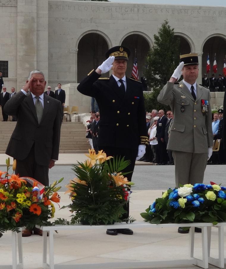 Members of th official party salute after laying their wreaths.