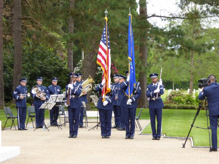 An American Color Guard and Brass Air Force Band participate in the ceremony. 