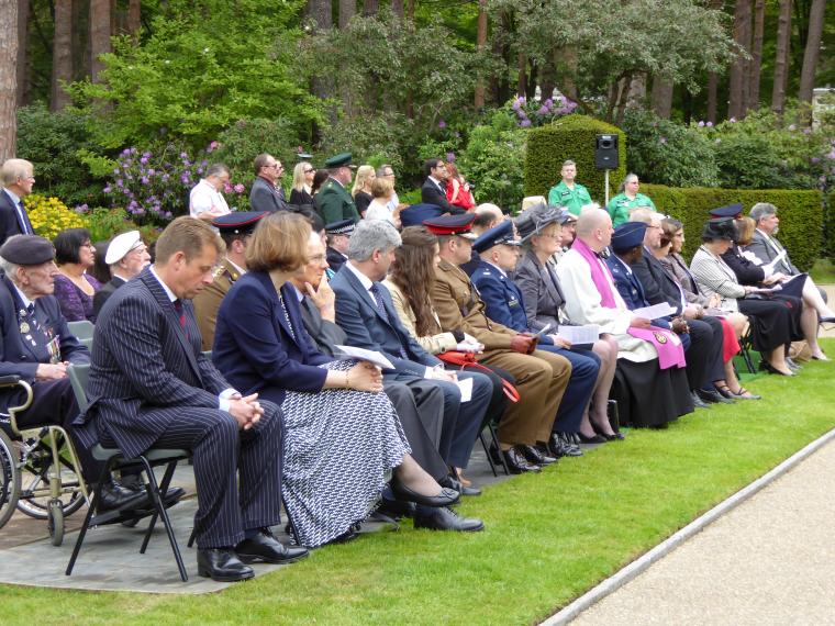 Members of the crowd sit during the ceremony.