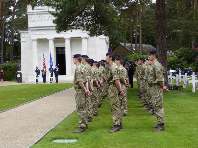 Members of British military stand during the ceremony. 