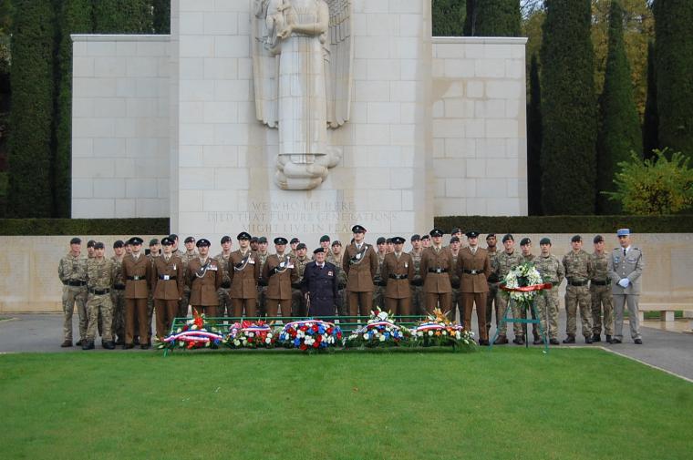 Participants stand behind the wreaths after the ceremony. 