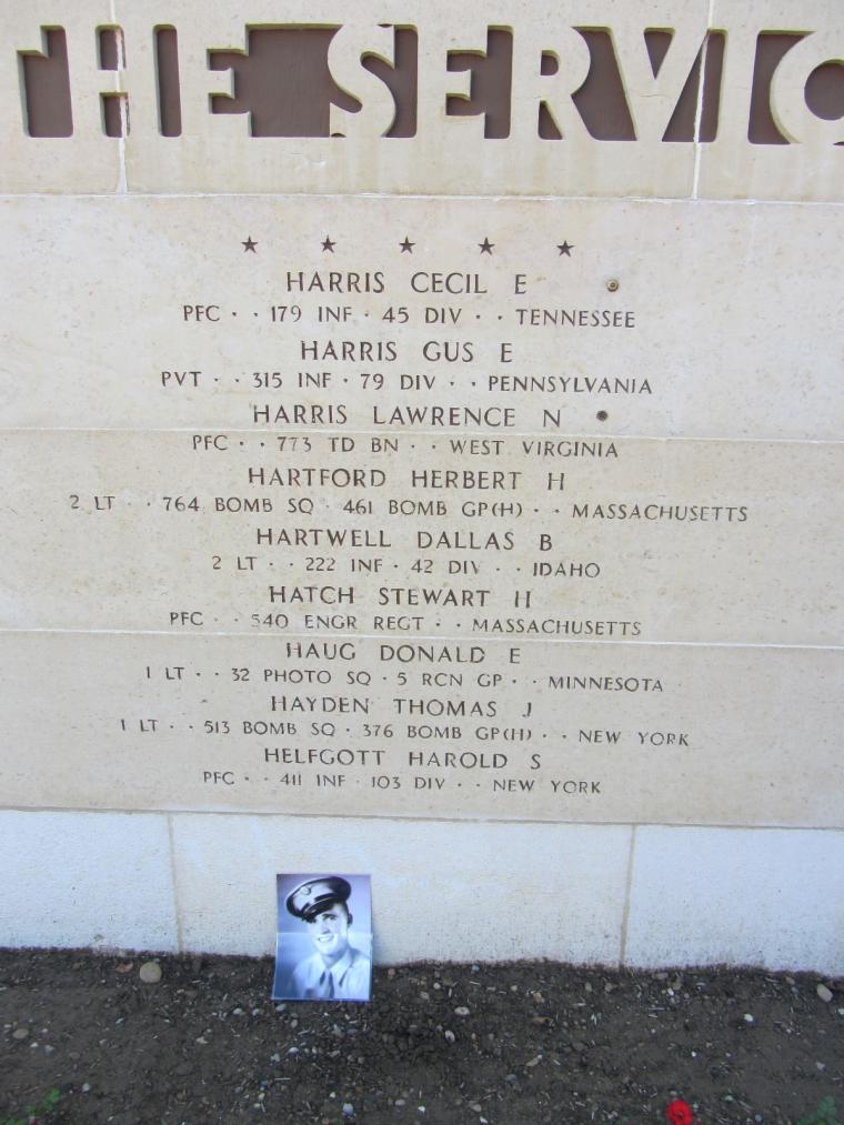 A photo of Pfc. Harris rests against the Wall of the Missing. 