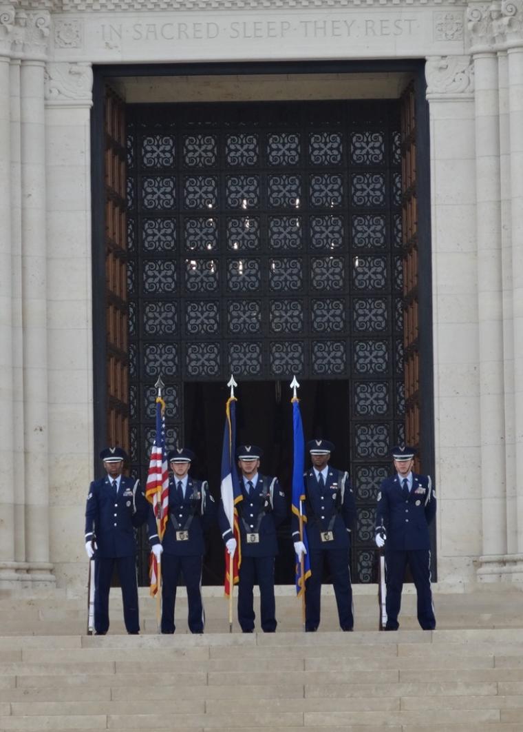 The Honor Guard stands in the ready position outside the chapel. 