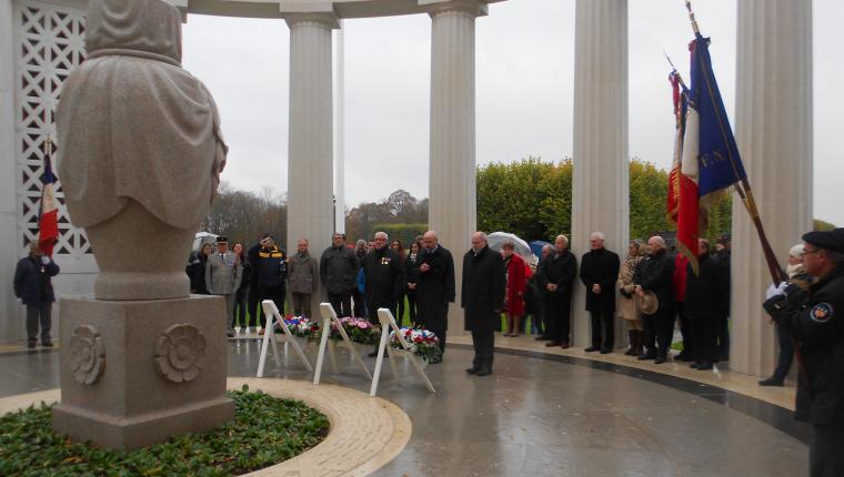 Attendees bow their heads after the wreath laying.