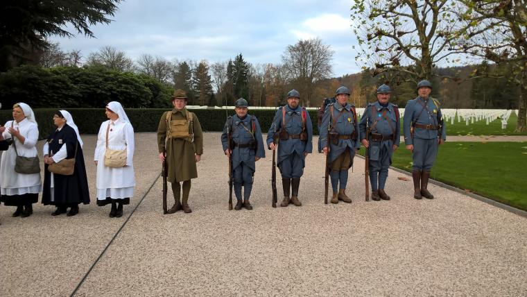 Men and women dress as re-enactors for the ceremony. 