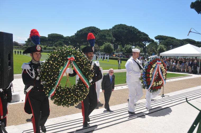 Wreaths are carried by members of the military.